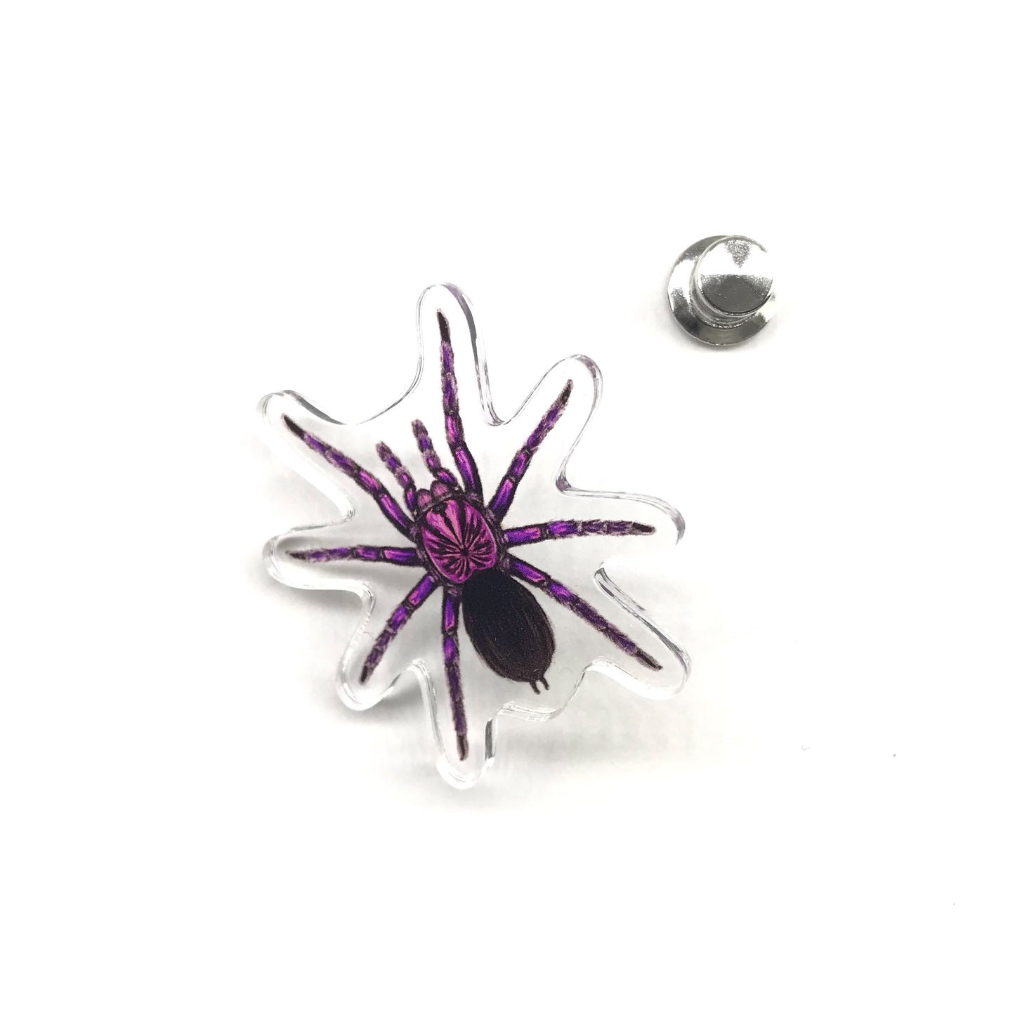 Purple Bloom Tarantula acrylic pin from The Silk Ranch featuring a detailed purple and black tarantula design.